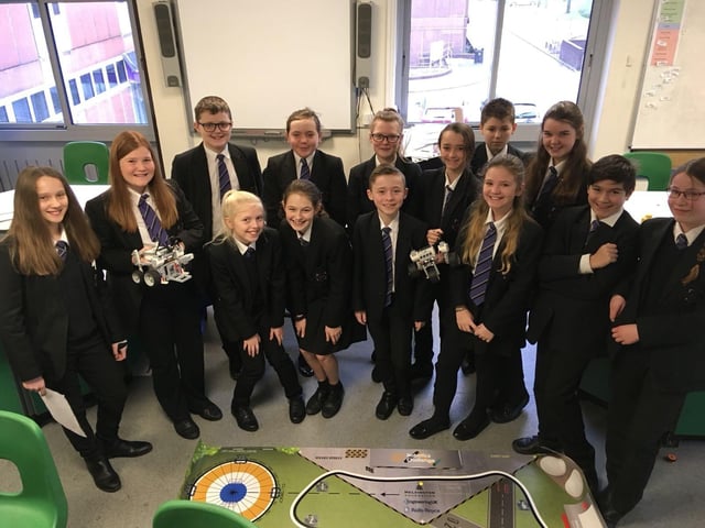 Students from Sutton Community Academy with their robotics project in 2018.