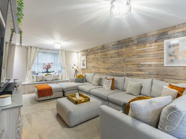 Let's begin our tour of the £550,000-plus Mansfield house in this expansive living room. The bay window, facing the front, allows plenty of natural light to fill the space.