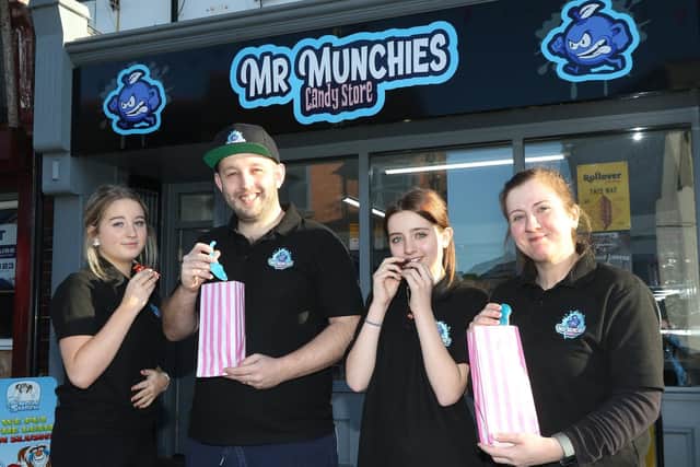 Bradley Mower with wife Rebecca and daughters Lillie and Chloe outside the Mr Munchies shop in Kirkby.