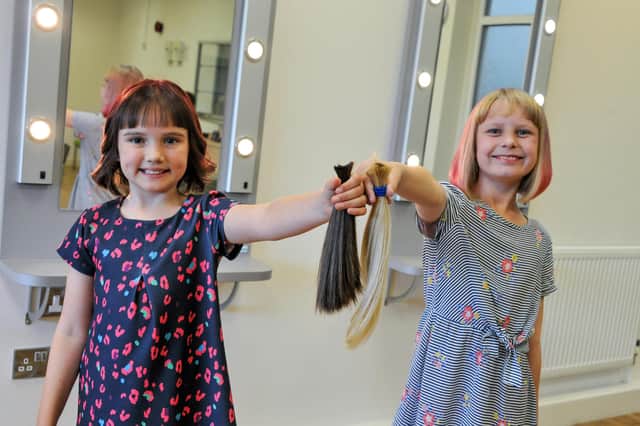 Grace Gibson and Isabelle Freezer after their haircuts. Photos: Louise Brimble