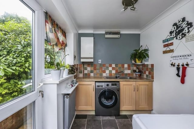 Just off the kitchen is this useful utility room, which has space and plumbing for a washing machine and tumble dryer. It is fitted with base units, incorporating a sink and drainer, plus vinyl flooring. A door leads to the beautiful back garden.