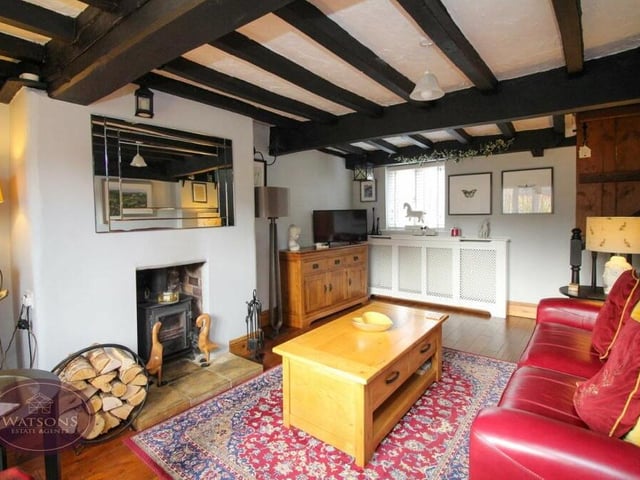 The lounge also boasts a feature fireplace with inset multi-fuel burner, and engineered oak flooring.