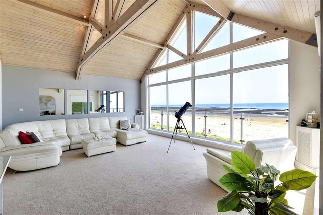 The largest of the property's three reception rooms features floor to ceiling double glazed windows which provide uninterrupted views of the beach and north sea.