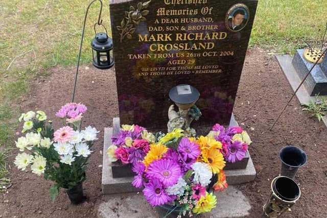 AFTER - how Mark Crossland's grave looks now after its new surround was removed by cemetery staff.