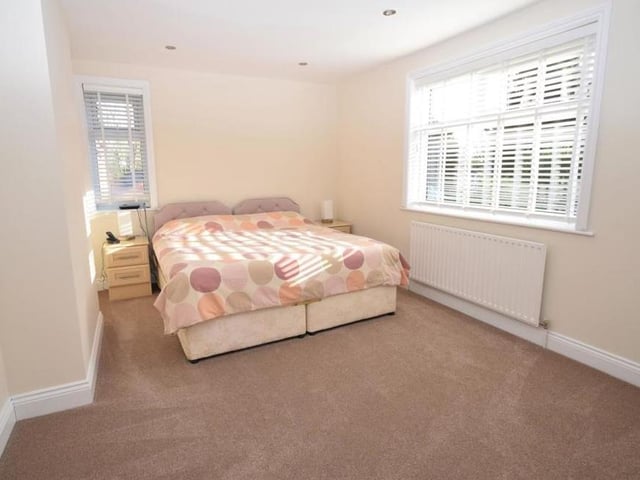 Another pleasant double bedroom. Downlighting adds to the feel of the room, which is wonderfully bright thanks to uPVC windows to the side and rear of the house.