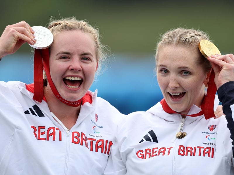 Hope Gordon and Charlotte Henshaw show off their Va'a medals.