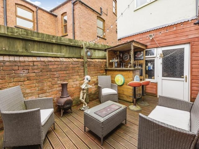 It's time to step outside now, and here is the private courtyard, complete with pleasant, decked seating area and mini-bar.
