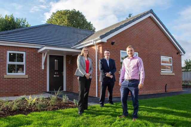 Coun Helen-Ann Smith, Paul Parkinson, ADC Director Housing and Assets and Coun Tom Hollis outside one of the new bungalows on The Beeches.