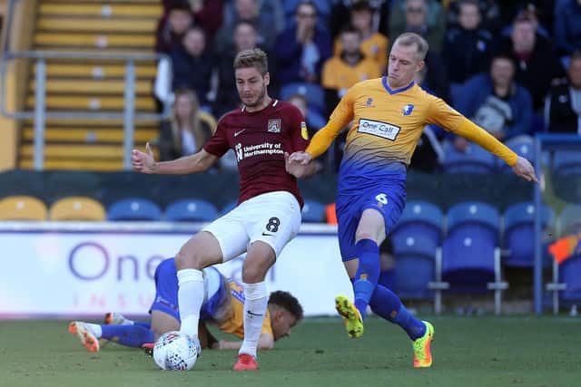 Neal Bishop battles for the with Northampton's Sam Foley early in the 2018/19 season. (Photo by Pete Norton/Getty Images)