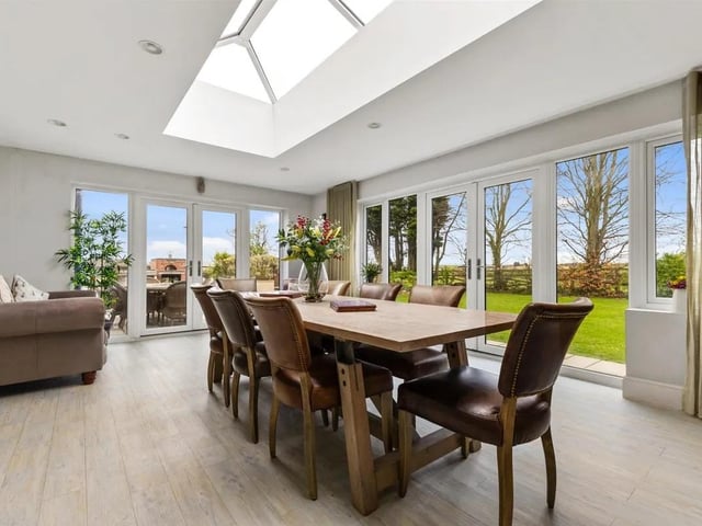 A light and airy reception room with views around the garden.