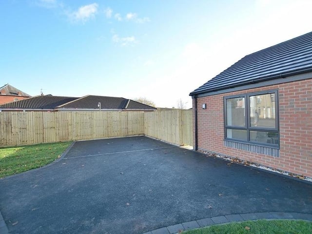 Our last look at the Sutton bungalow shows the front garden, private driveway and turning space.