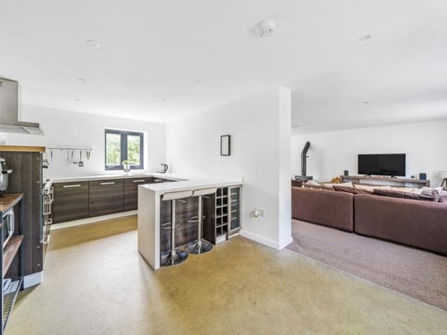 Flowing seamlessly from the living room is this contemporary kitchen, which also boasts oodles of space.