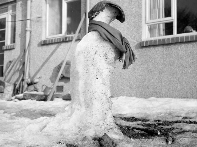 A snowman, complete with bunnet and scarf, melting in a Corstorphine garden in 1963.