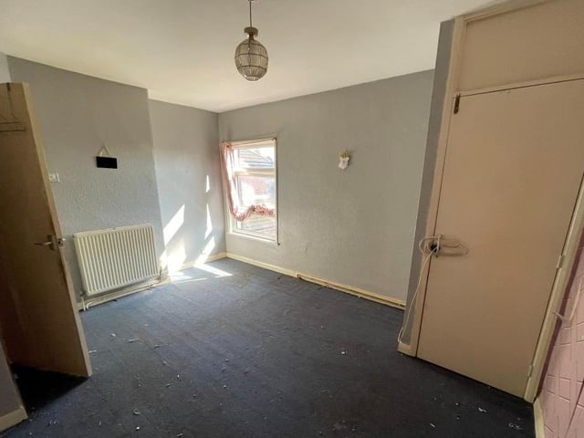 The staircase in the inner hallway leads to the first-floor landing, which has access to the attic room and also the two bedrooms. This is the first bedroom, with a window overlooking the front of the property.