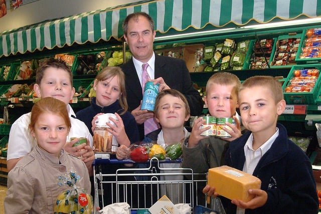 Pupils from Robin Hood Primary School, in 2007, Mansfield Woodhouse, visited the Co-op store to buy ingredients to cook. The visit was part of the Co-op's 'Farm To Fork' project. Pictured with Gary Alexander, Farm To Fork project co-ordinator in Nottinghamshire, are (left to right) Dana Wood, Brett Smith, Lauren Jones, Bill Pinnick, Bradley Strouther, Thomas Dawson, all from Class Four.