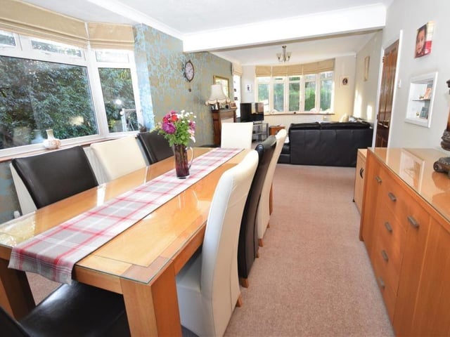Just off the lounge is this delightful dining room. It is perfect for family meals or for entertaining friends in a formal setting.
