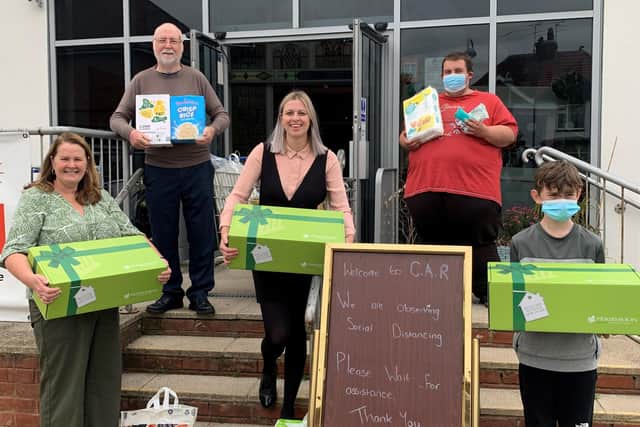 Sophie Cherry from Persimmon (centre) delivering some of the collected items to Liz Phillips (far left) together with other members of the Lifespring team