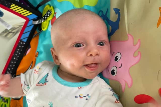 Little Oliver is a "happy and healthy" baby, says dad Nathan.