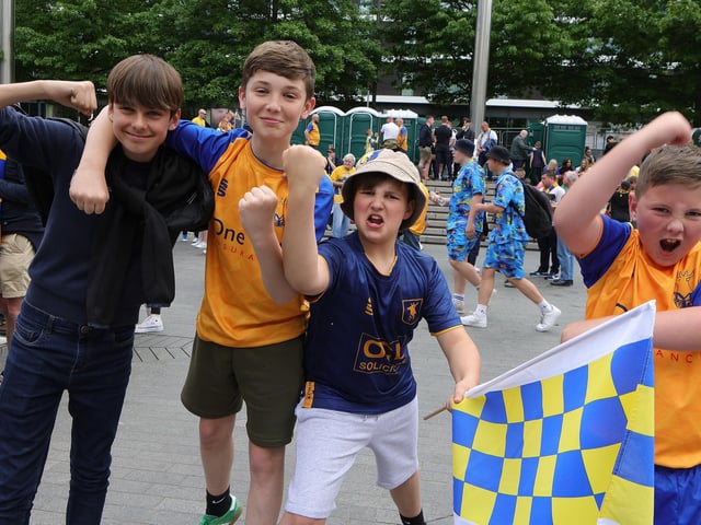 Mansfield Town fans soak up the Wembley atmosphere.