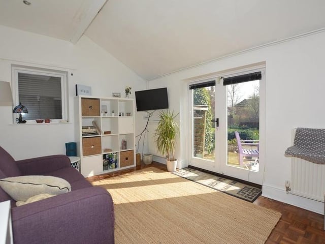 This image shows there is plenty of size and style to the annexe. Double-glazed double doors lead out into the garden.