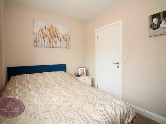 One of the four bedrooms at the £500,000 property on Baker Road, Newthorpe can be found on the ground floor. It faces the front of the house and has access to an en suite WC