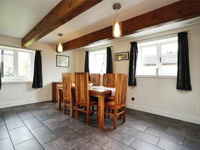 The dining room is the ideal spot for family meals or formal dining. It is a bright space too, thanks to dual-aspect windows.