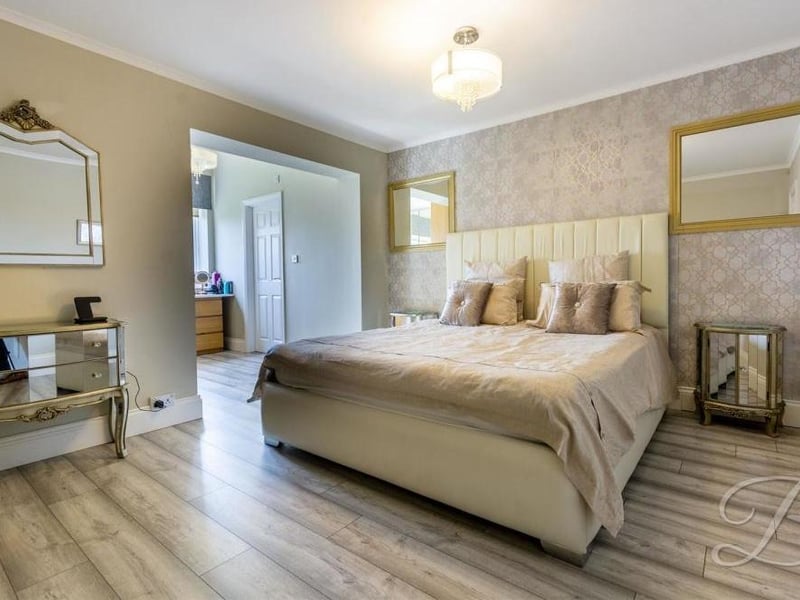The master bedroom is the largest of the five at the Lichfield Lane property. It has built-in wardrobes, a window overlooking the back of the house and access to an en suite