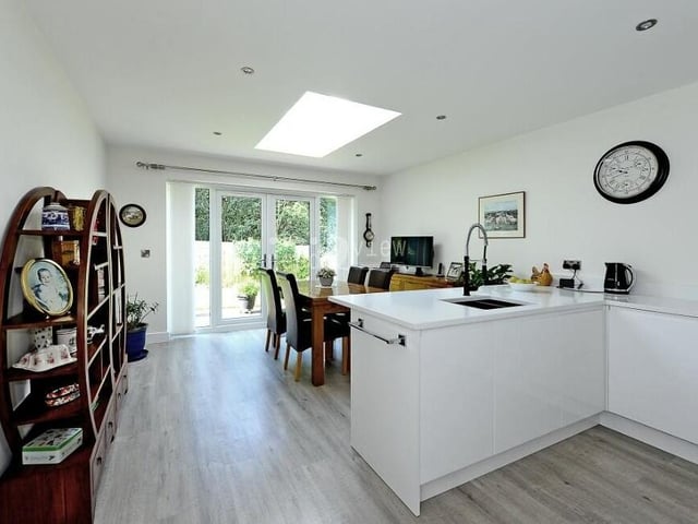 Modern luxury is a key feature of the bungalow, exemplified by this bright and spacious kitchen diner,. It is fully fitted and boasts a roof light window with electric blinds.