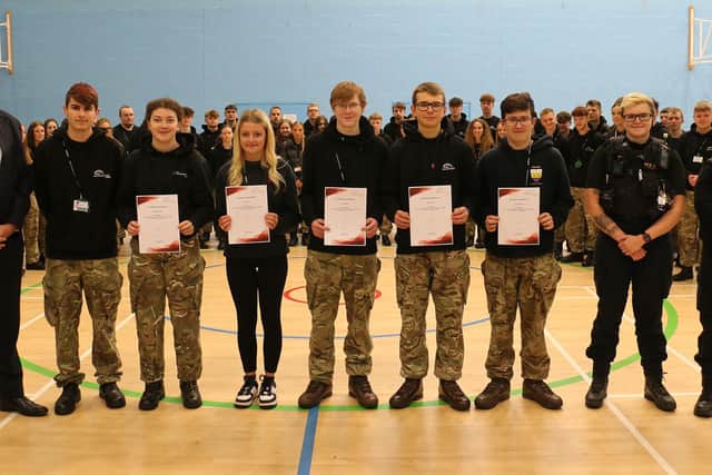 Principal Andrew Cropley (first left) with (from left) Daniel, Molly, Kelcie, Philip, Aidyn, George, PC Connellan and PC Hudson at the presentation of the certificates of achievement.