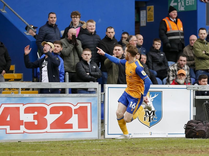 Stephen Quinn celebrates in front of the away end.