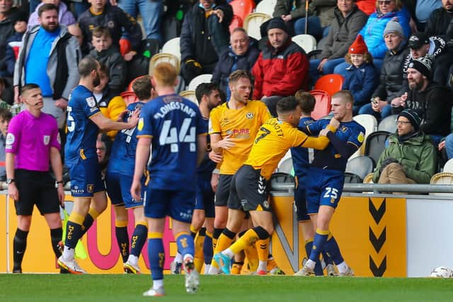 Players begin to pile into the second half melee at Newport. Photo by Chris Holloway/The Bigger Picture.media