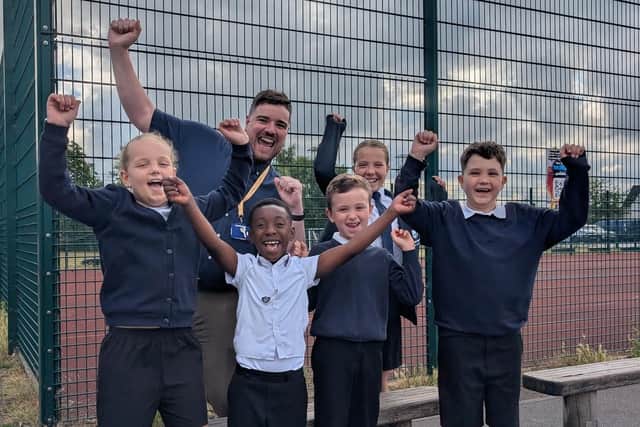 Staff and pupils at Samuel Barlow Primary Academy celebrate the latest Ofsted report
