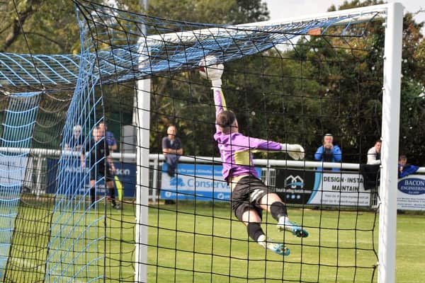 Man-of-the-match Hugo Warhurst makes a crucial save in thewin over Cleethorpes Town. Pic by Peter Craggs.