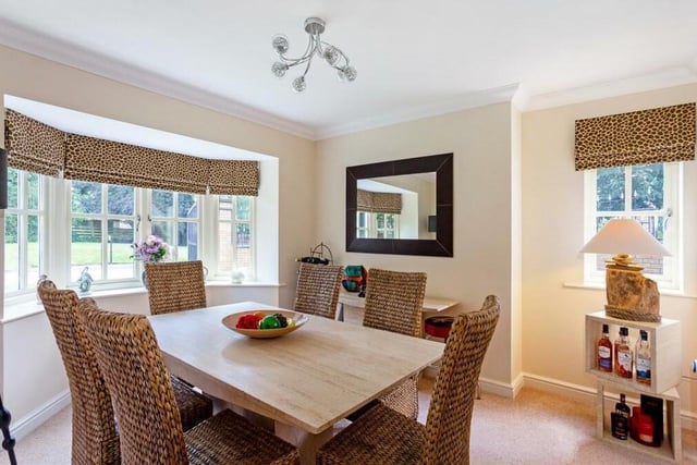 The fine dining room is a lovely space for family meals and for entertaining friends. A beautiful bay window overlooking the front of the house provides natural light and distinctive character.