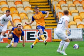 Oli Hawkins clears the ball against Sheffield United. Photo by Chris Holloway / The Bigger Picture.media
