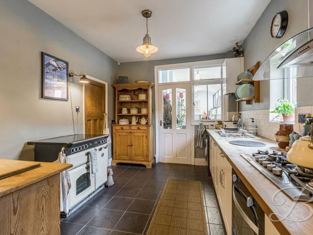 The kitchen, which doubles up as a dining room, boasts an integrated oven and gas hob with extractor fan. It has plumbing for a dishwasher and washing machine, and space for a Rangemaster cooker.