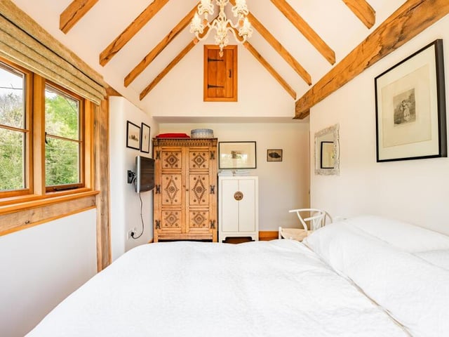 Bedroom number two at the £1.15 million property is again a generous size and again has vaulted ceilings.