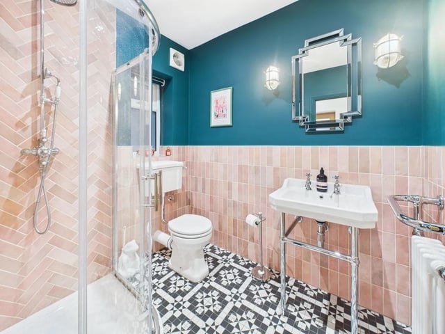 A stylish ground floor shower room with mains-fed shower and feature tiling offers additional convenience.