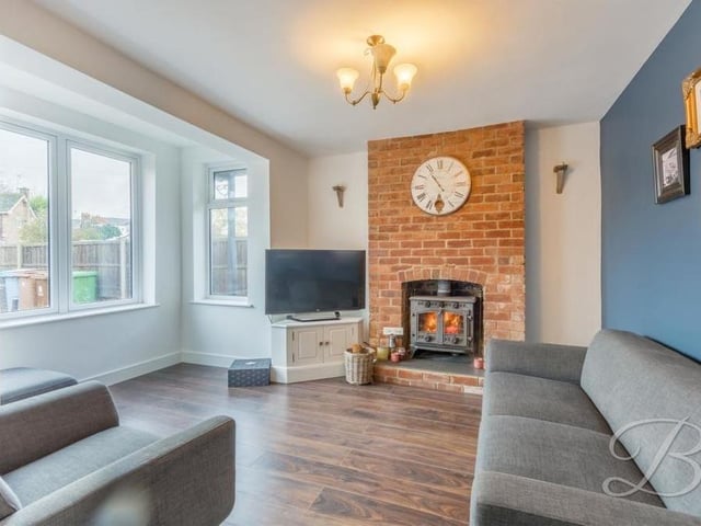 We start our tour of the Mansfield house in the warm and inviting lounge, which can be found just to the left of the entrance hallway. The cosy, relaxing atmosphere is encapsulated by the gorgeous log-burner with brick surround, and the oak flooring. The window faces the front of the property.