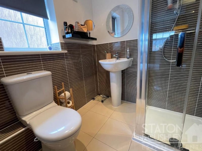 This terrific en suite shower room serves one of the first-floor bedrooms. And with a shower cubicle, low-level WC, pedestal sink with mixer tap and a heated towel-rail, it does a great job!