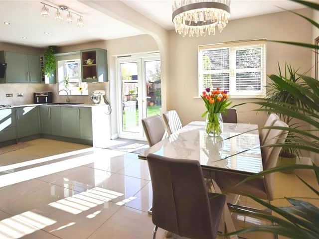 The kitchen flows into the dining space, perfect for family life.