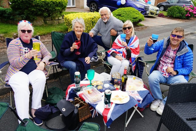 Residents raise their glasses to the Queen on Delamere Drive.