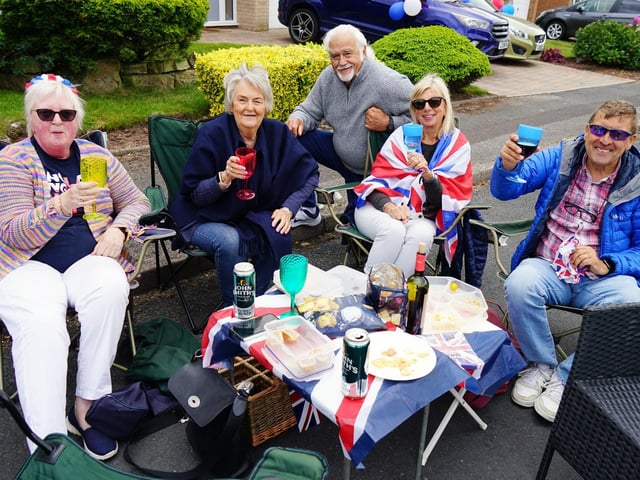 Residents raise their glasses to the Queen on Delamere Drive.