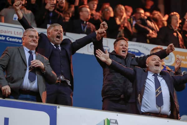 Mansfield Town's fans and players celebrated promotion to League One long into the night.