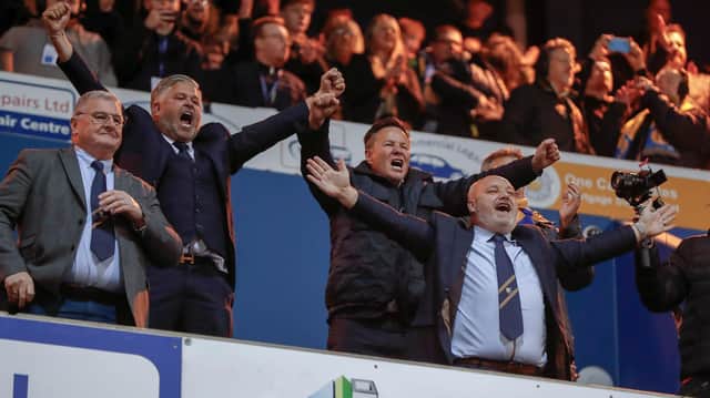 Mansfield Town's fans and players celebrated promotion to League One long into the night.