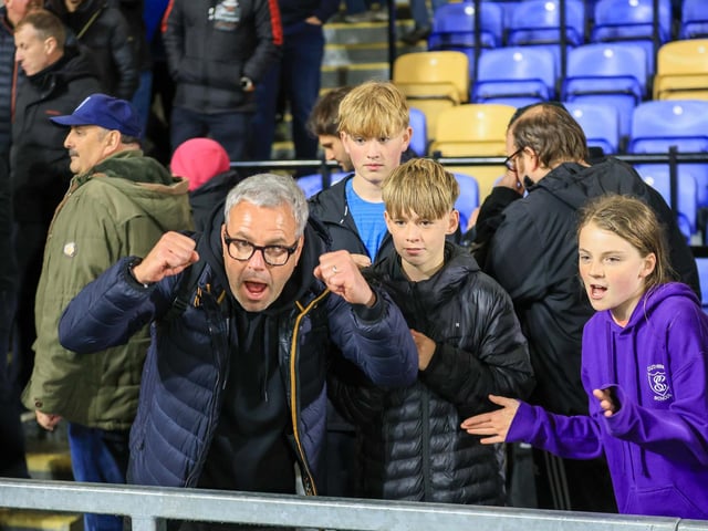 Travelling Mansfield Town fans during the Sky Bet League One match against AFC Wimbledon at Stadium Plough Lane.