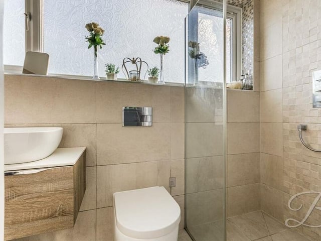 More en suite excellence at the Chestnut Drive property, courtesy of shower enclosure, low-flush WC and wash hand basin.
