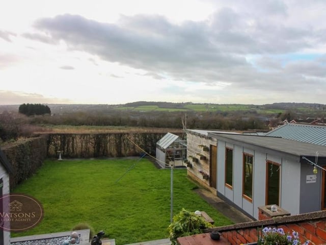 Before we go any further, let's take a look at those spectacular views over open fields that estate agents Watsons are raving about. To the right is the back garden's summer house which is also a major selling point for the bungalow.