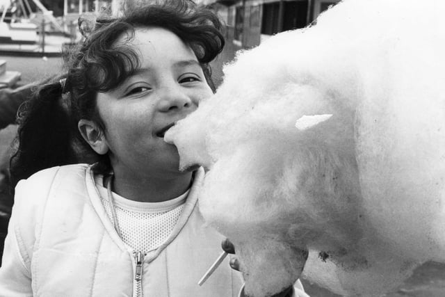 Leanne Urwin, 8, tucks into candy floss at the fairground in this April 1983 photo in South Shields.