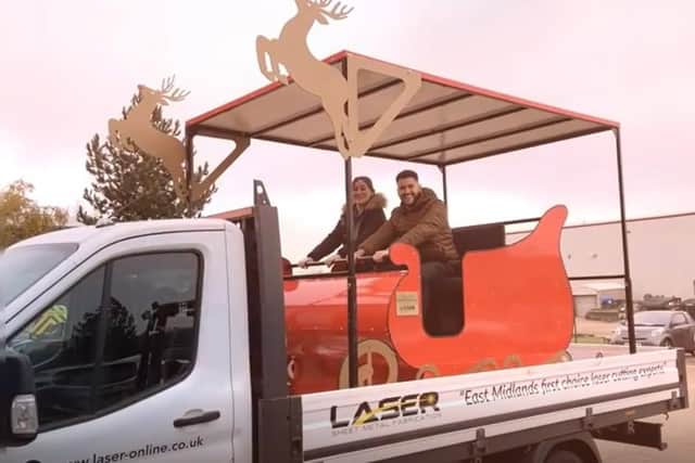 Laser Limited staff riding the new sleigh as it leaves the depot.